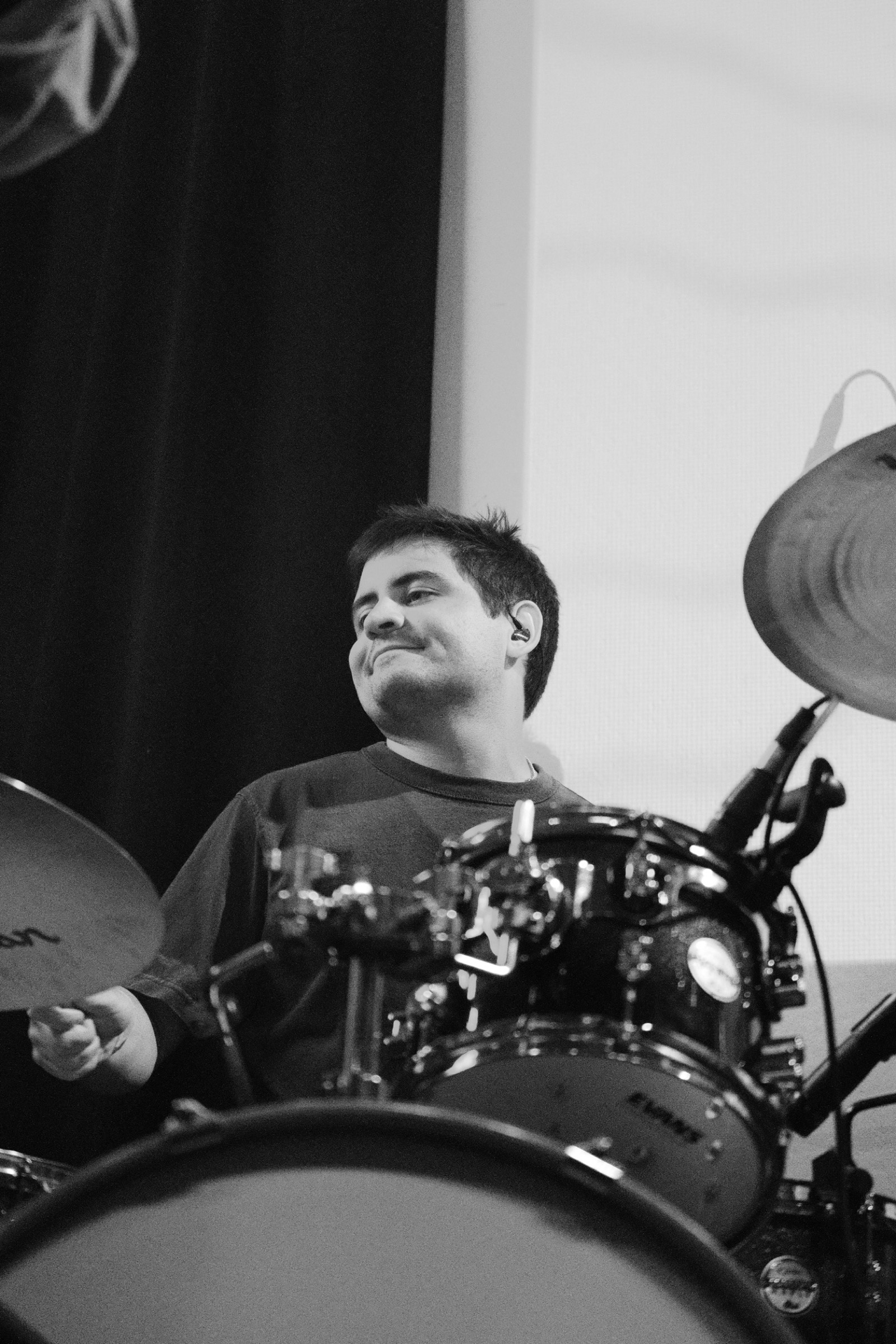 Drummer playing with in-ear monitors